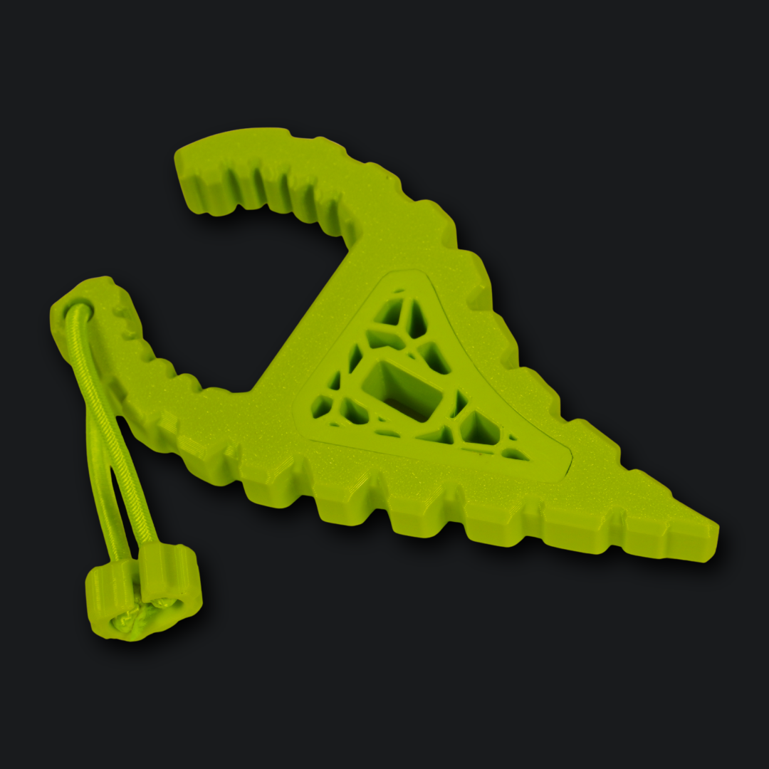 A bright lime green 3D-printed triangular anchor with a triangular lattice pattern in the center and a small attached loop with a cord, shown on a dark background.